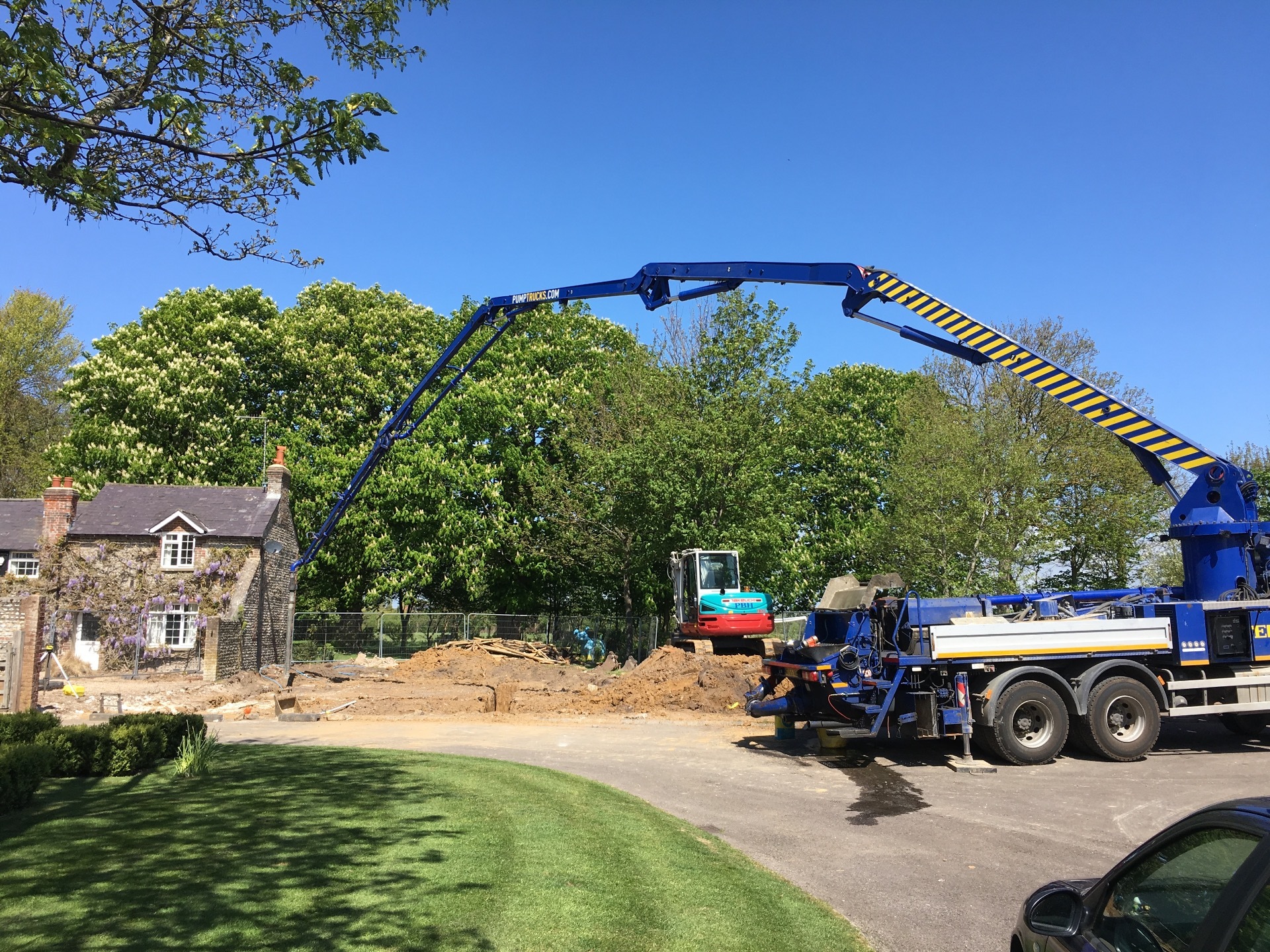 One of K Crumley Construction's mini excavators being unloaded for an equestrian project in West Sussex.